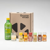 The Ginger Shot Easter open gift box. It contains 6 types of 30 ml bottles of Ginger Shot Classic, Turmeric, Pineapple, Pomegranate, Acai and Fruit as well as a 360 ml bottle of Ginger Shot Classic and a shot glass.